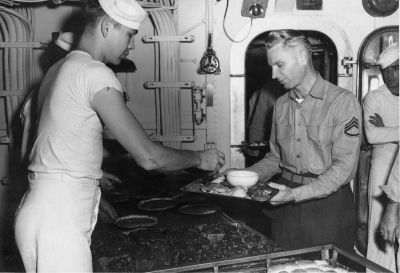 039_Thanksgiving_1949_-_R_Wilson_MMFN_serving2C_Sgt__Receiving.jpg