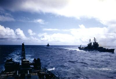 CA-74 USS Columbus off port
